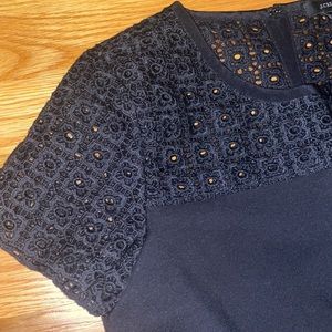 Size 0 black short sleeve Jcrew dress. Top has lacey design